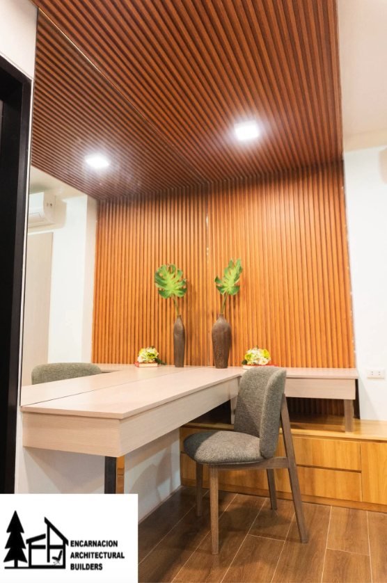 Study nook built against a full height timber slat wall, with a mirrored return